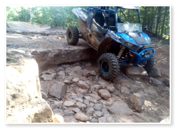 A sxs going down a steep incline on the buckhorn trail system