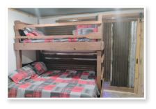 A bedroom in one of our cabins